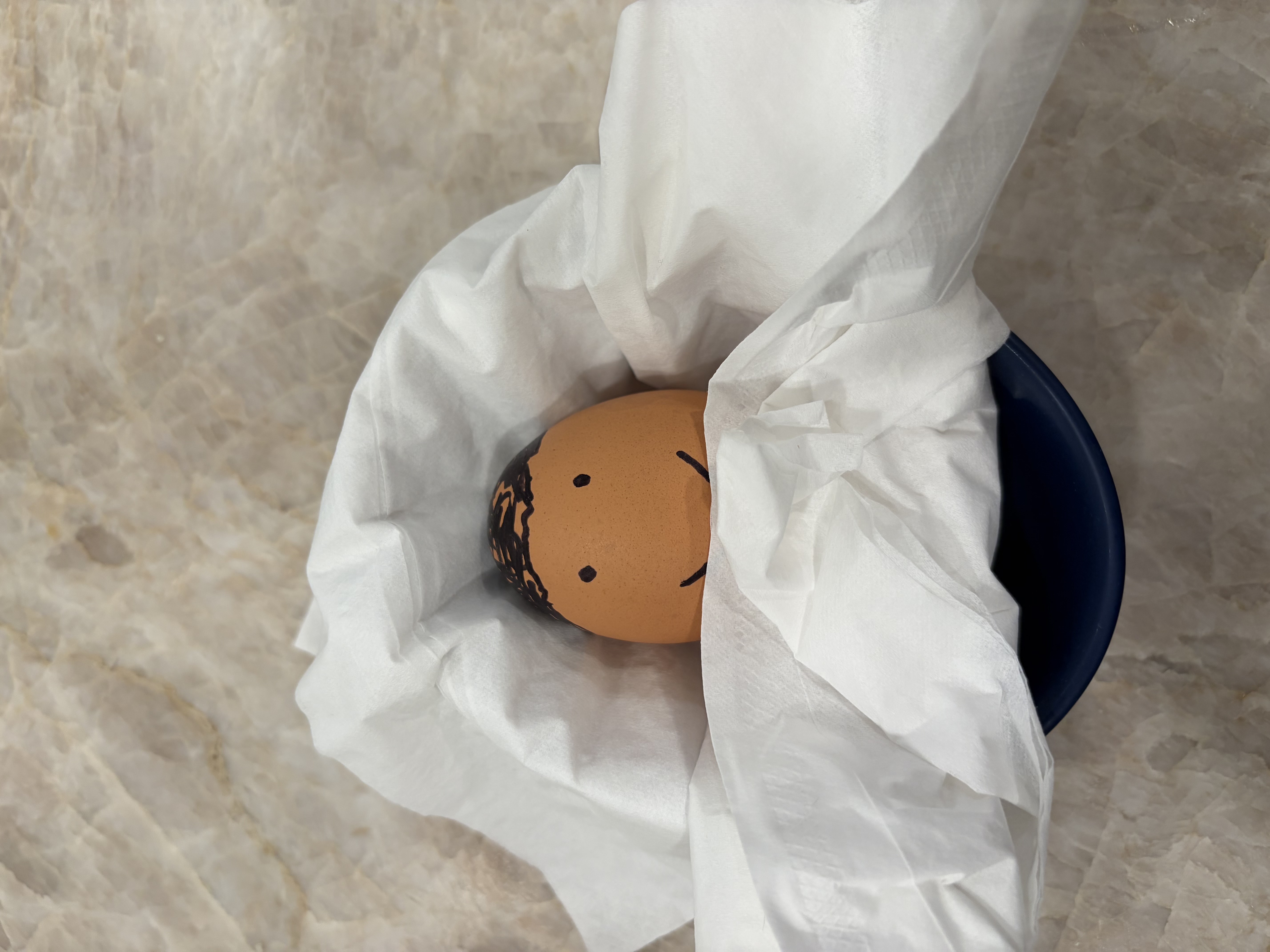 Pete Buttigieg the egg baby wrapped in blankets